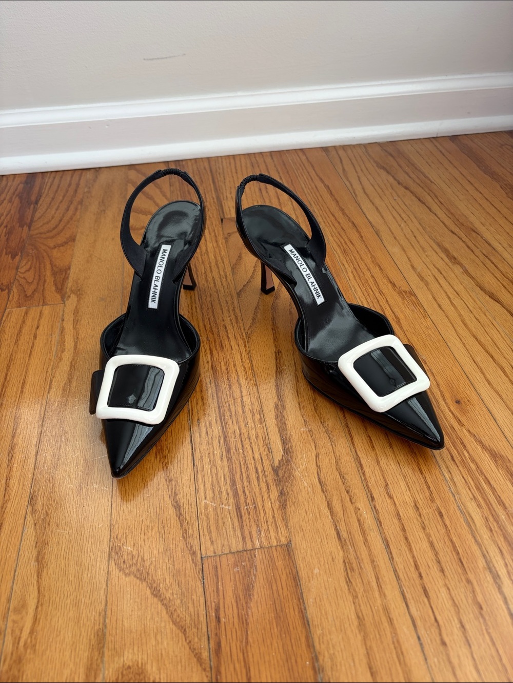 Manolo Blahnik Black Patent Slingback Pumps with White Buckle Accent
